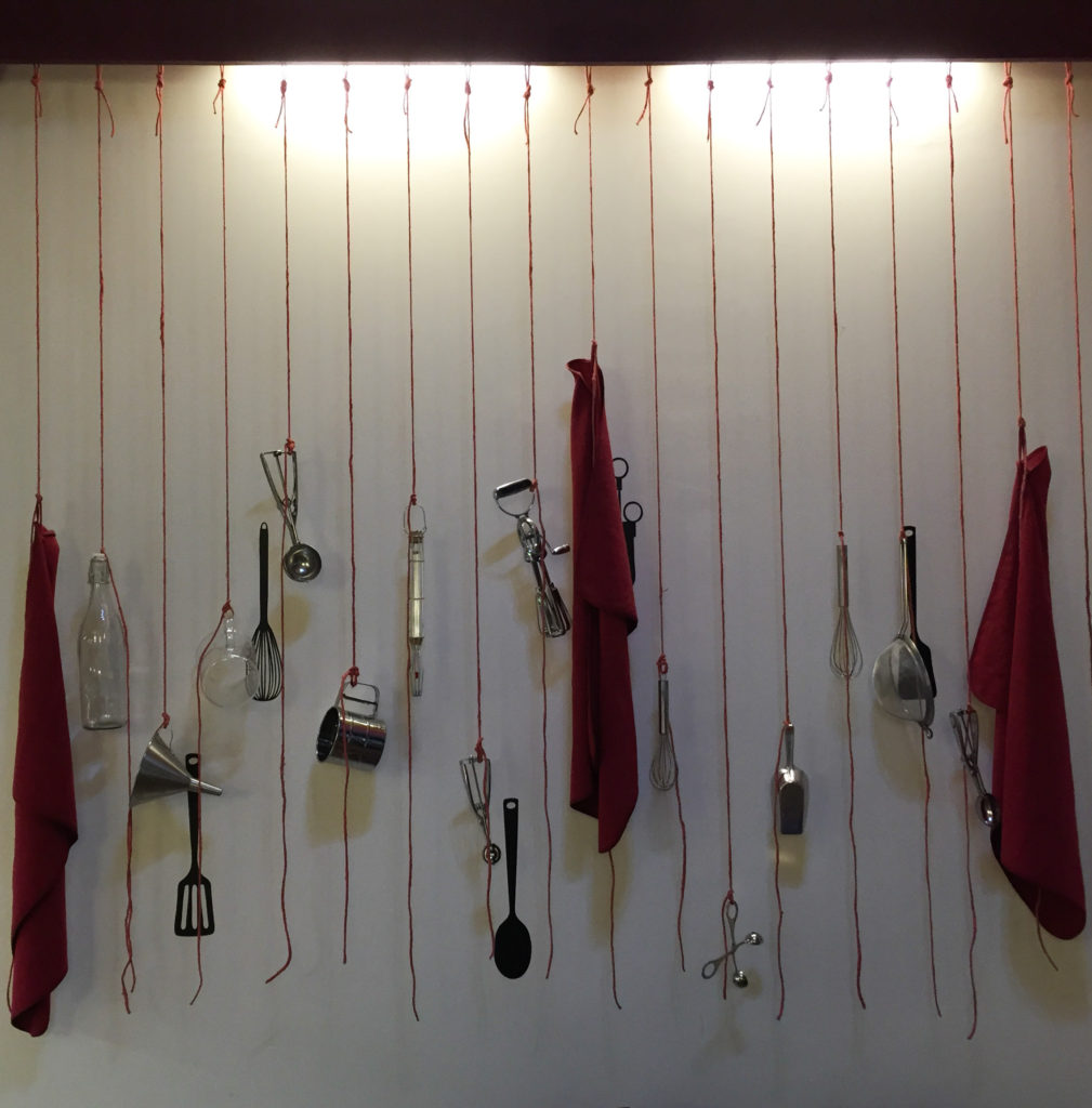 Implements hanging in a little ice cream shop in Orvieto Italy