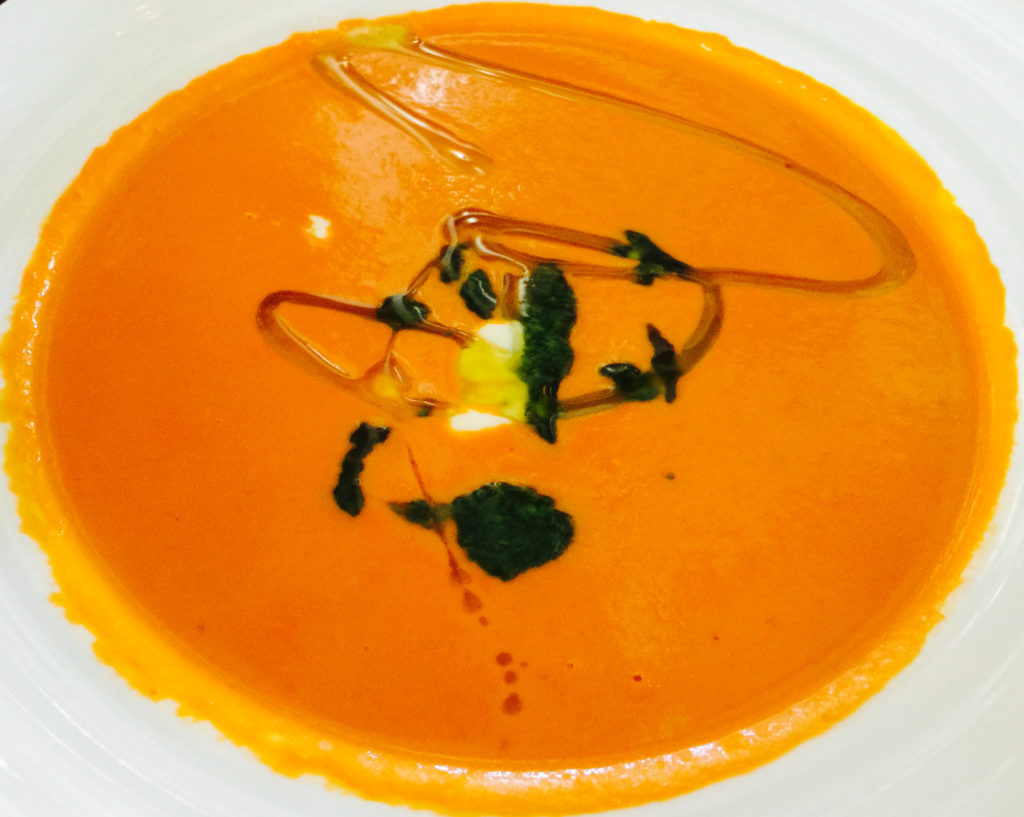 Tomato Soup with a Dash of Basil Oil at Farmstead in St. Helena California