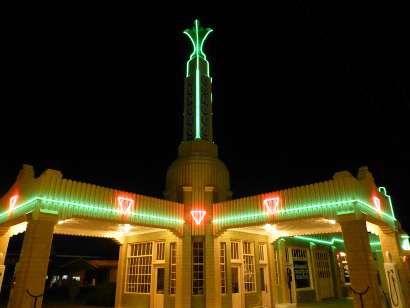 A building in Shamrock, Texas, lit up at night