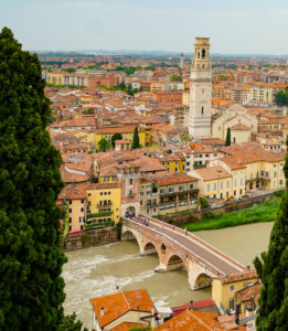 Ponte Pietra or Stone Bridge. It is a must-stroll on your one day in Verona, Italy!