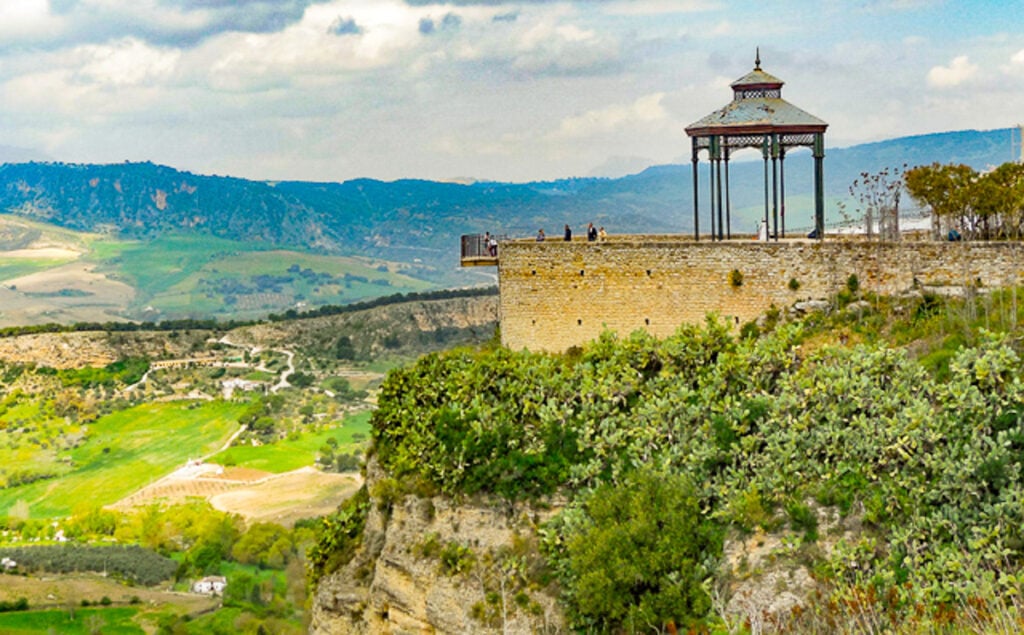 Taking in the views from the mirador at the Alameda del Tajo is one of the top things to do in Ronda, Spain!