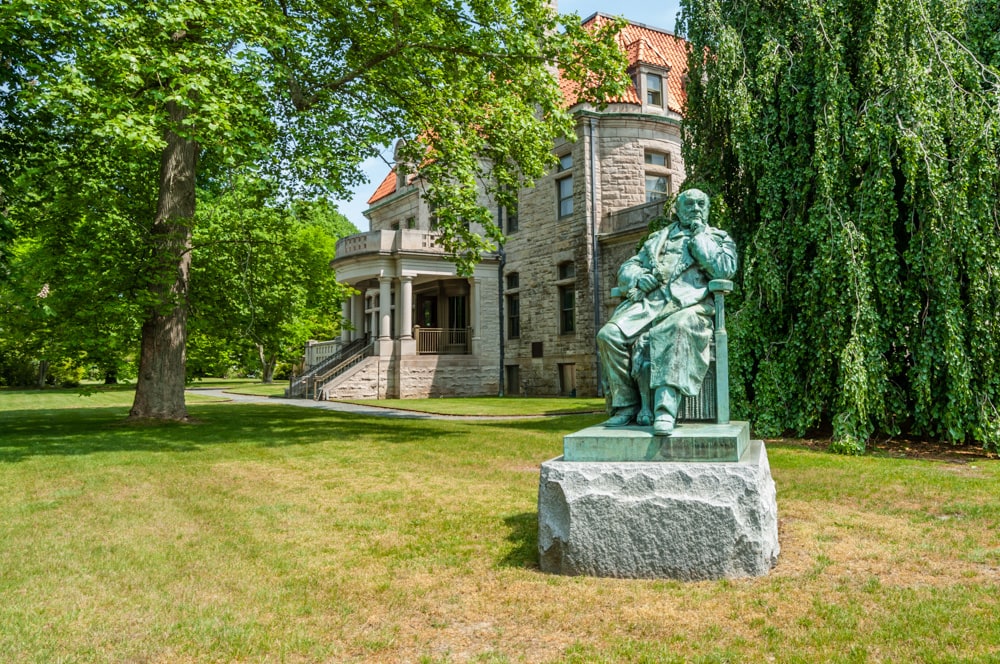 A statue stands on the grounds of a historic mansion in Newport, RI
