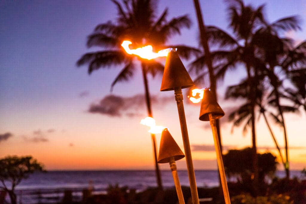 Hawaiian tiki torches at sunset