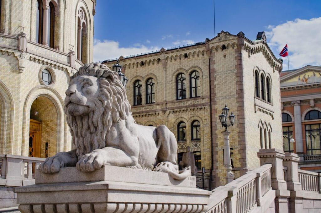One of the two lions guarding the entrance to the Parliament building in Oslo, Norway