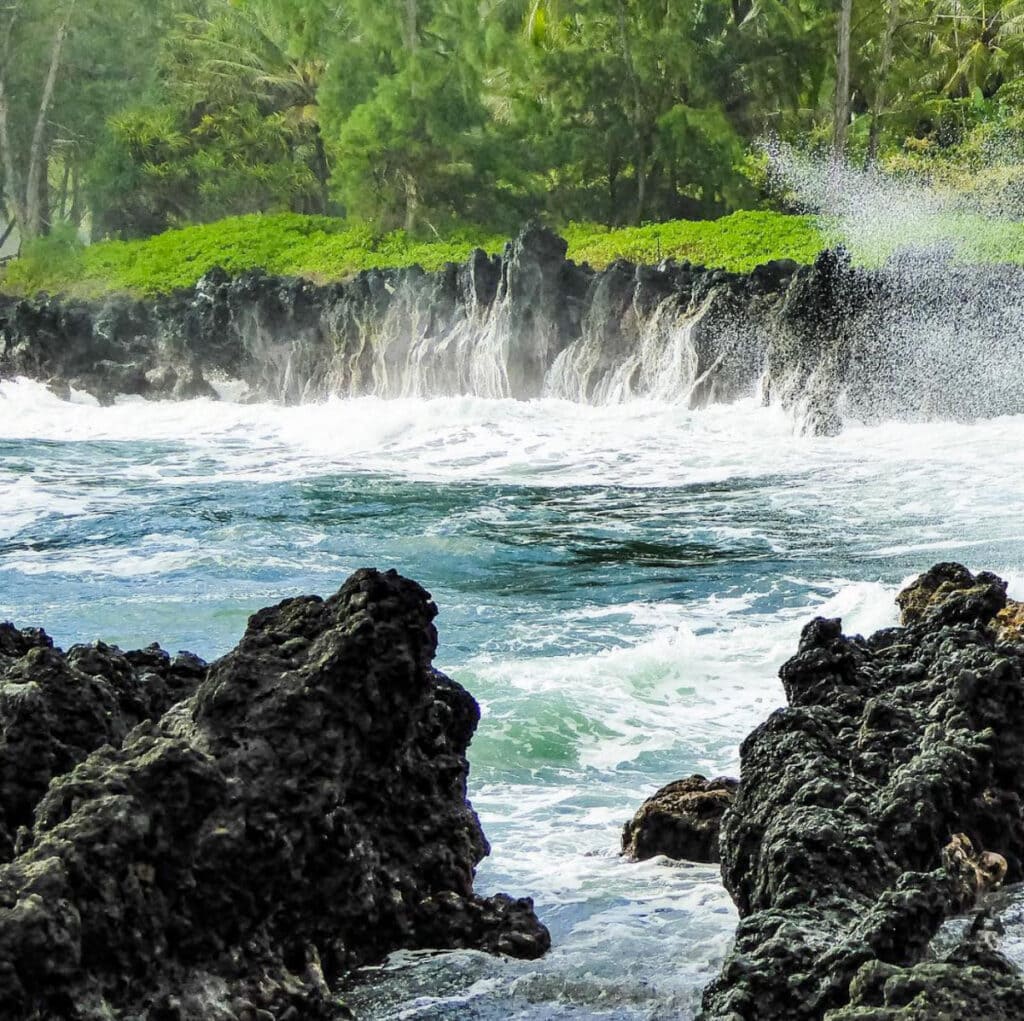 Waves crashing on the rocks at the Keanae Peninsula in Maui, HI