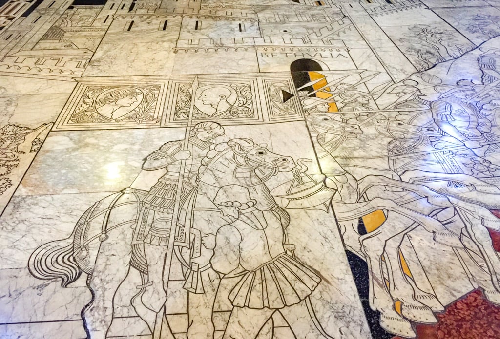The floor of the Siena Cathedral features beautiful paintings.