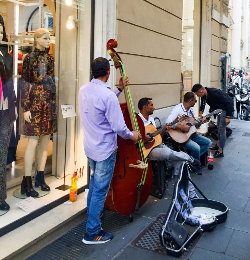 Street musicians on Via del Corso, Rome, Italy
