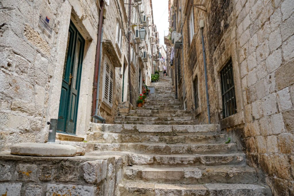 Walking up steps from Stradun in Old Town Dubrovnik, Croatia